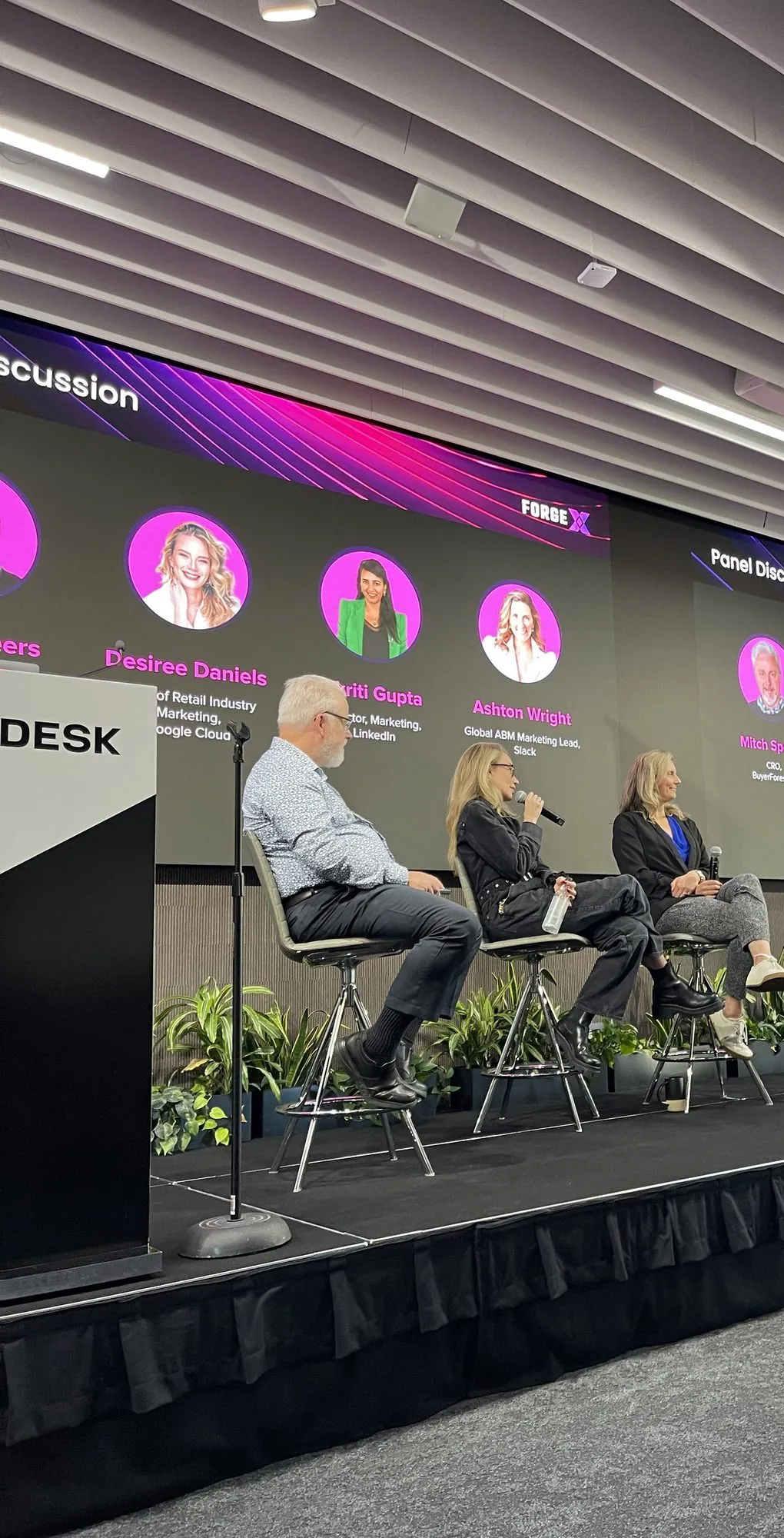 A panel of GTM leaders on stage at a ForgeX roadshow